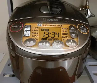 a toaster sitting on top of a stove at KOSUMOSU Ikebukuro Shinjuku Private House in Tokyo