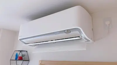 a kitchen with a white overhead oven in a room at KOSUMOSU Ikebukuro Shinjuku Private House in Tokyo