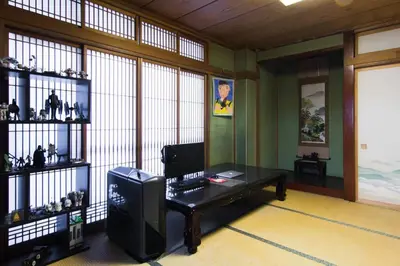a room with a desk with a computer on it at Mochida's Guest House in Tokyo