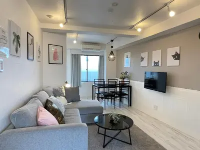 a living room with a couch and a table at Hotel Ougien in Tokyo