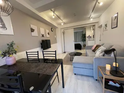 a living room with a couch and a table at Hotel Ougien in Tokyo