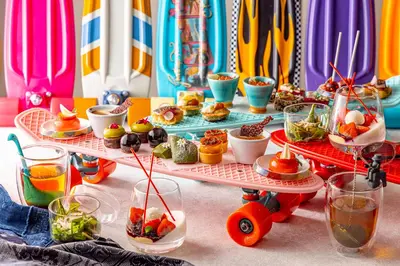 a table topped with plates of food and drinks at Hotel Indigo Tokyo Shibuya in Tokyo