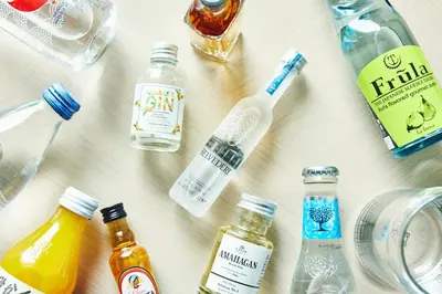 a table topped with bottles of alcohol and drinks at Hotel Indigo Tokyo Shibuya in Tokyo