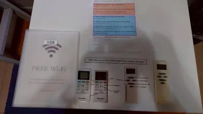 a white box with a free wifi sign on it at Rize Apartments in Tokyo
