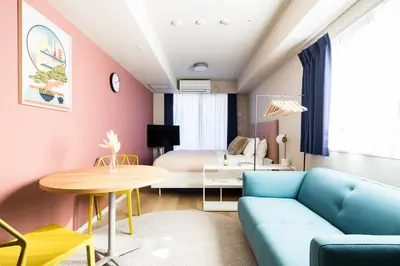 a living room with a couch and a table at Section L Residence Ginza in Tokyo