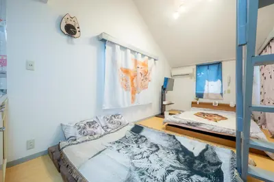 a bedroom with a bunk bed and a bunk bed at Tokyo Shibuya Shinjyuku Cat House ! in Tokyo