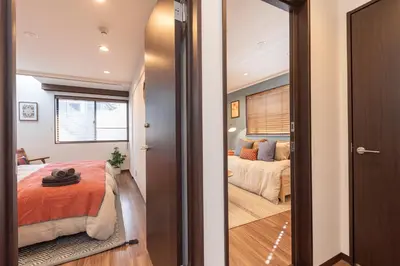 a bedroom with a bed and a window at LiveGRACE Hotel Shibuya \u6e0b\u8c37\u897f\u65b0\u5bbf in Tokyo