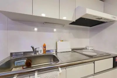 a kitchen with a sink and a counter top at EK House SkyTree in Tokyo