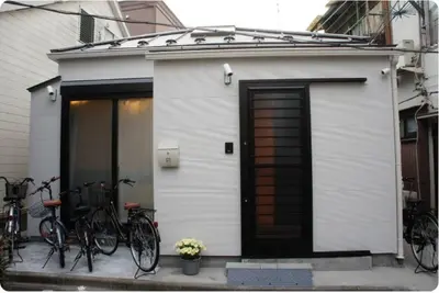 a group of bikes parked next to a building at EK House SkyTree in Tokyo