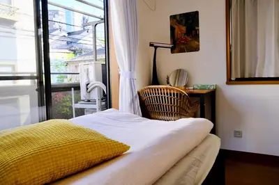 a bedroom with a bed and a large window at Shinjuku/Kabukichō｜Super Busy Area｜Cozy House｜85㎡ in Tokyo