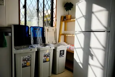 a group of trash cans in a room with a refrigerator at Shinjuku/Kabukichō｜Super Busy Area｜Cozy House｜85㎡ in Tokyo