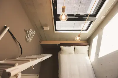 a room with a bed and a window at Hotel Tabiya in Tokyo