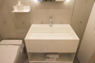 a bathroom with a sink and a toilet at Hotel Tabiya in Tokyo