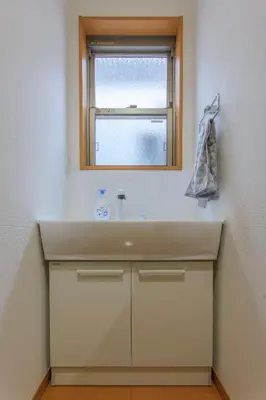 a bathroom with a sink and a window at Sky House BnB in Tokyo