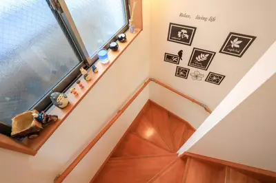 a staircase in a house with a window at Sky House BnB in Tokyo