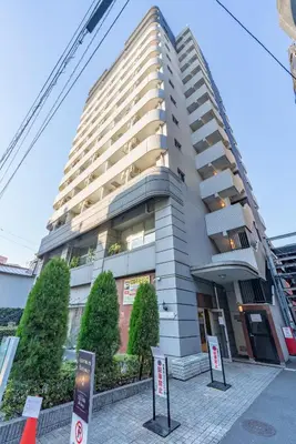 a tall building with signs in front of it at Tokyo's best spot Shibuya! 3person room Free Wi-Fi in Tokyo