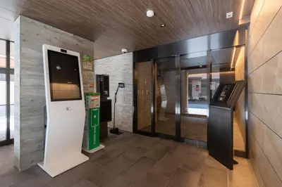 a lobby with a ticket machine in a building at KISETSU\u65e9\u7a32\u7530l in Tokyo