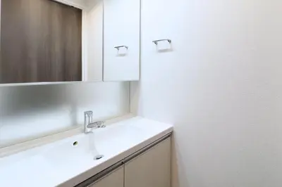 a bathroom with a sink and a mirror at KISETSU\u65e9\u7a32\u7530l in Tokyo