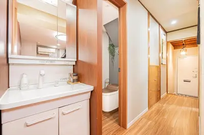 a bathroom with a sink and a mirror at Ueno Park Asakusa Temple Ueno Family Inn in Tokyo
