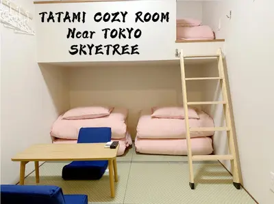 a room with two bunk beds and a ladder at \u548c\u7e01WAEN in Tokyo