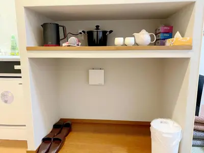 a shelf in a kitchen with a pot on it at \u548c\u7e01WAEN in Tokyo