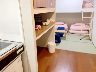 a small room with a closet with pink towels at \u548c\u7e01WAEN in Tokyo
