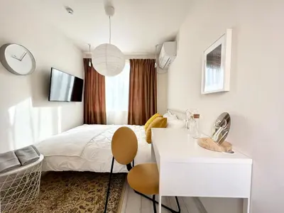 a bedroom with a bed and a table and a chair at TYO Ikebukuro Designer’s Apt 101 in Tokyo