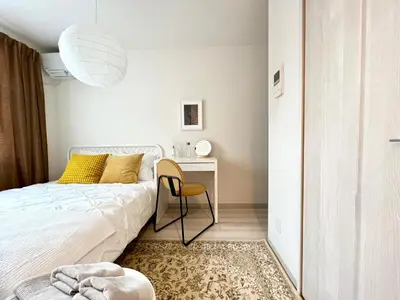 a bedroom with a bed and a desk and a chair at TYO Ikebukuro Designer’s Apt 101 in Tokyo