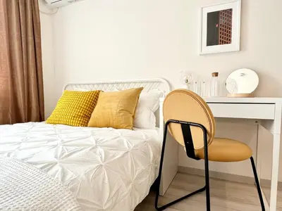 a bedroom with a bed with a desk and a chair at TYO Ikebukuro Designer’s Apt 101 in Tokyo