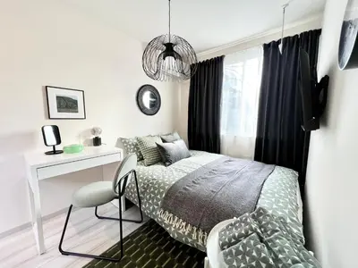 a bedroom with a bed and a desk and a chair at TYO Ikebukuro Designer’s Apt 102 in Tokyo