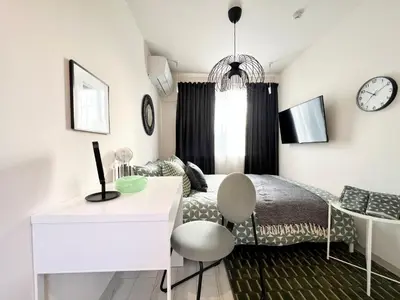 a bedroom with a bed and a desk and a chair at TYO Ikebukuro Designer’s Apt 102 in Tokyo