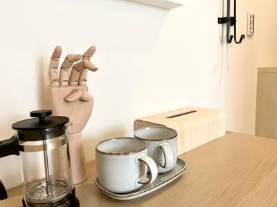 a counter with two cups of coffee and a toaster at TYO Ikebukuro Designer’s Apt 103 in Tokyo