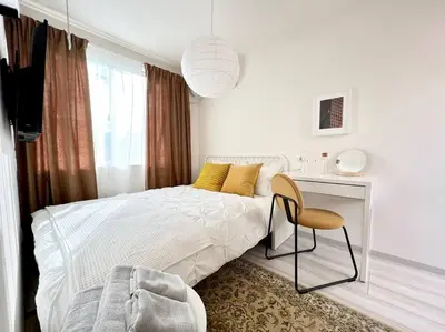 a bedroom with a bed and a desk and a chair at TYO Ikebukuro Designer’s Apt 201 in Tokyo