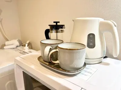 a counter with two coffee cups and a blender at TYO Ikebukuro Designer’s Apt 202 in Tokyo