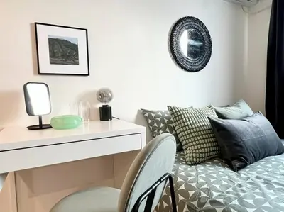 a white room with a bed and a table and chairs at TYO Ikebukuro Designer’s Apt 202 in Tokyo