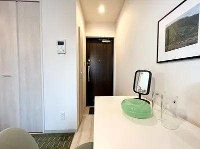 a mirror sitting on a counter in a room at TYO Ikebukuro Designer’s Apt 202 in Tokyo