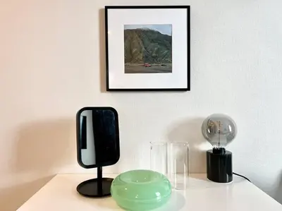 a table with a black phone and a green bowl at TYO Ikebukuro Designer’s Apt 202 in Tokyo
