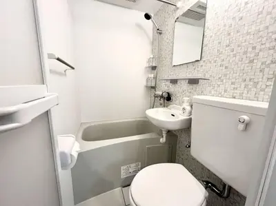 a small bathroom with a toilet and a sink at TYO Ikebukuro Designer’s Apt 302 in Tokyo
