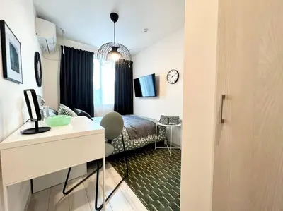 a room with a bed and a desk in a room at TYO Ikebukuro Designer’s Apt 302 in Tokyo
