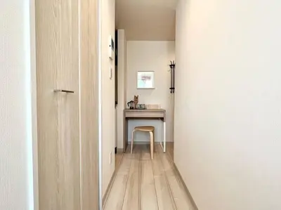 a hallway with a table and a chair in a room at TYO Ikebukuro Designer’s Apt 303 in Tokyo