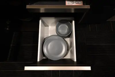 a microwave with two plates and two dishes in it at RAKU Hotel Tokyo Bay Front in Tokyo
