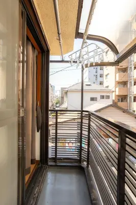 a balcony of a building with a view of a city at 3BR Entire House for7 #91Rated TraditionCozy Japanese Villa in Ikebukuro 6mins St in Tokyo