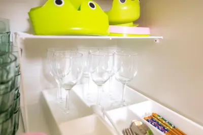 a row of wine glasses on a shelf in a refrigerator at 3BR Entire House for7 #91Rated TraditionCozy Japanese Villa in Ikebukuro 6mins St in Tokyo