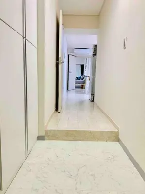 a hallway in a building with a white floor at Asakusa 2 Bedroom Apartment \u897f\u6d45\u83492LDK\u5e83\u3005\u30d5\u30a1\u30df\u30ea\u30fcor\u30b0\u30eb\u30fc\u30d7 in Tokyo