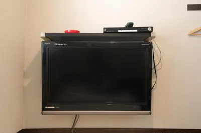 a television with a controller on top of it at \u30d7\u30c1\u30db\u30c6\u30eb\u3000\u30b3\u30b9\u30e2\u30b9 in Tokyo
