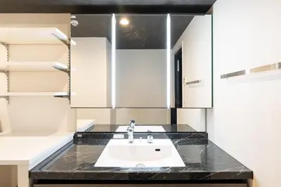 a bathroom with a sink and a mirror at CREAL premier\u8d64\u5742 in Tokyo