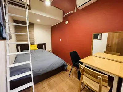 a bedroom with a bunk bed and a desk at Asakusa，2BR Cozy Detached House，10mins to Sensō-ji in Tokyo