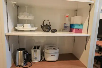 a kitchen pantry with a coffee maker and a toaster at self-check in-5mins walk from shinokubo station free wifi in Tokyo