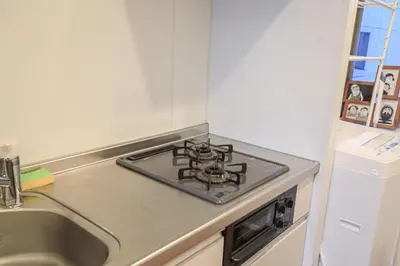 a stove top in a kitchen next to a sink at self-check in-5mins walk from shinokubo station free wifi in Tokyo