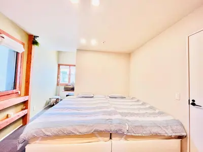 a bedroom with a large bed in a room at \u6c60\u888bApila in Tokyo